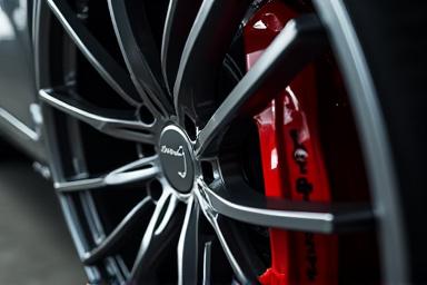 Icon representing a custom alloy wheel and performance brake.
